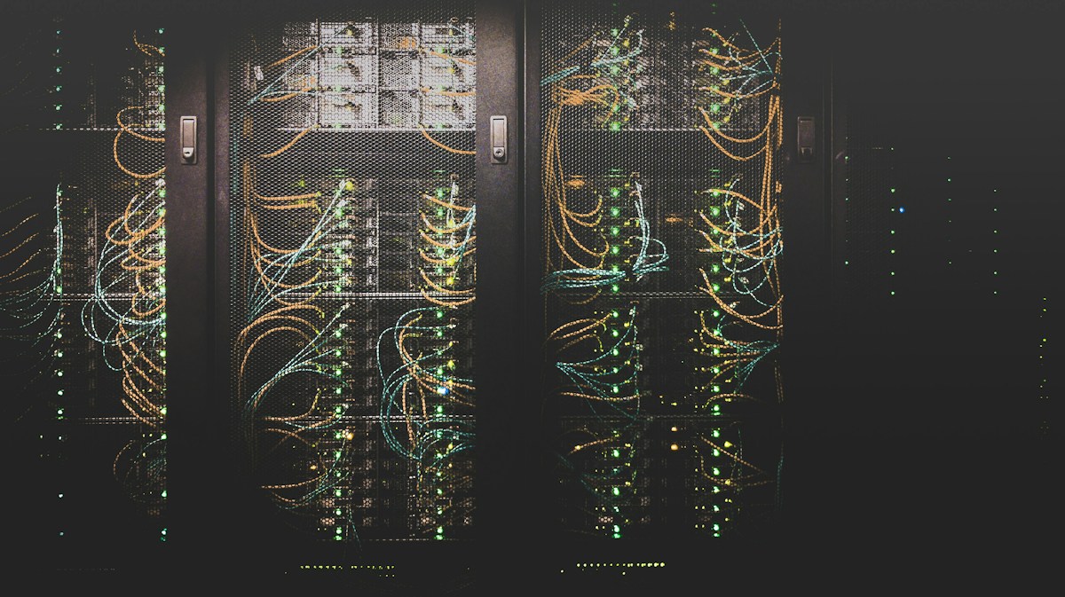 Server room with blinking equipment lights.